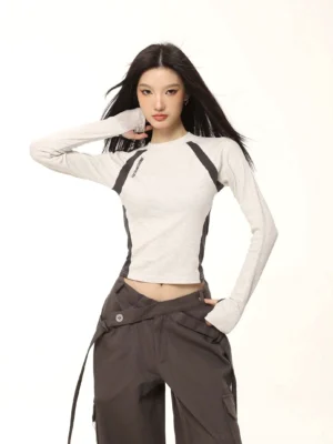 Heather grey contrast raglan cropped long sleeve top styled with dark grey cargo pants in a front streetwear outfit view