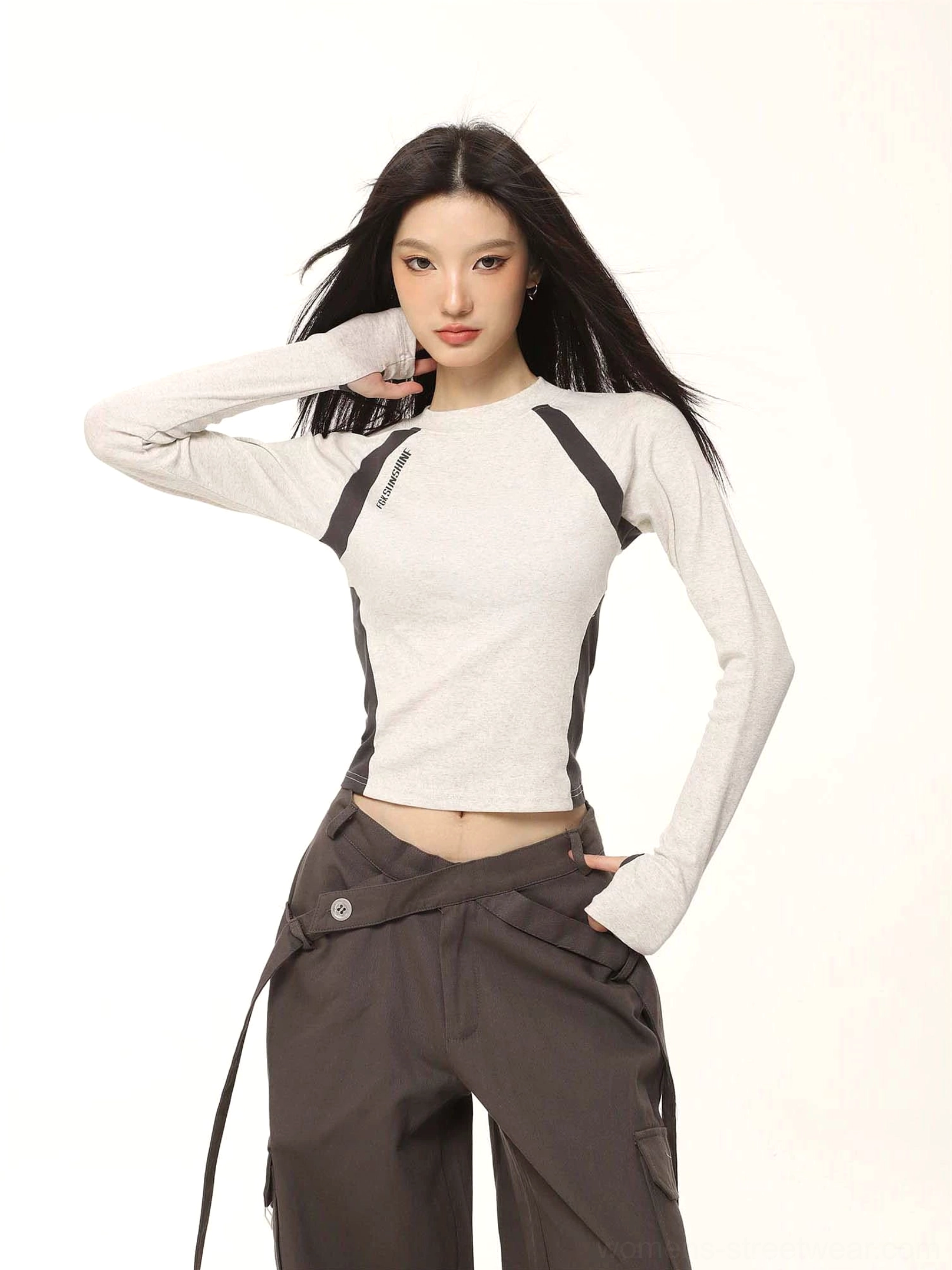 Heather grey contrast raglan cropped long sleeve top styled with dark grey cargo pants in a front streetwear outfit view