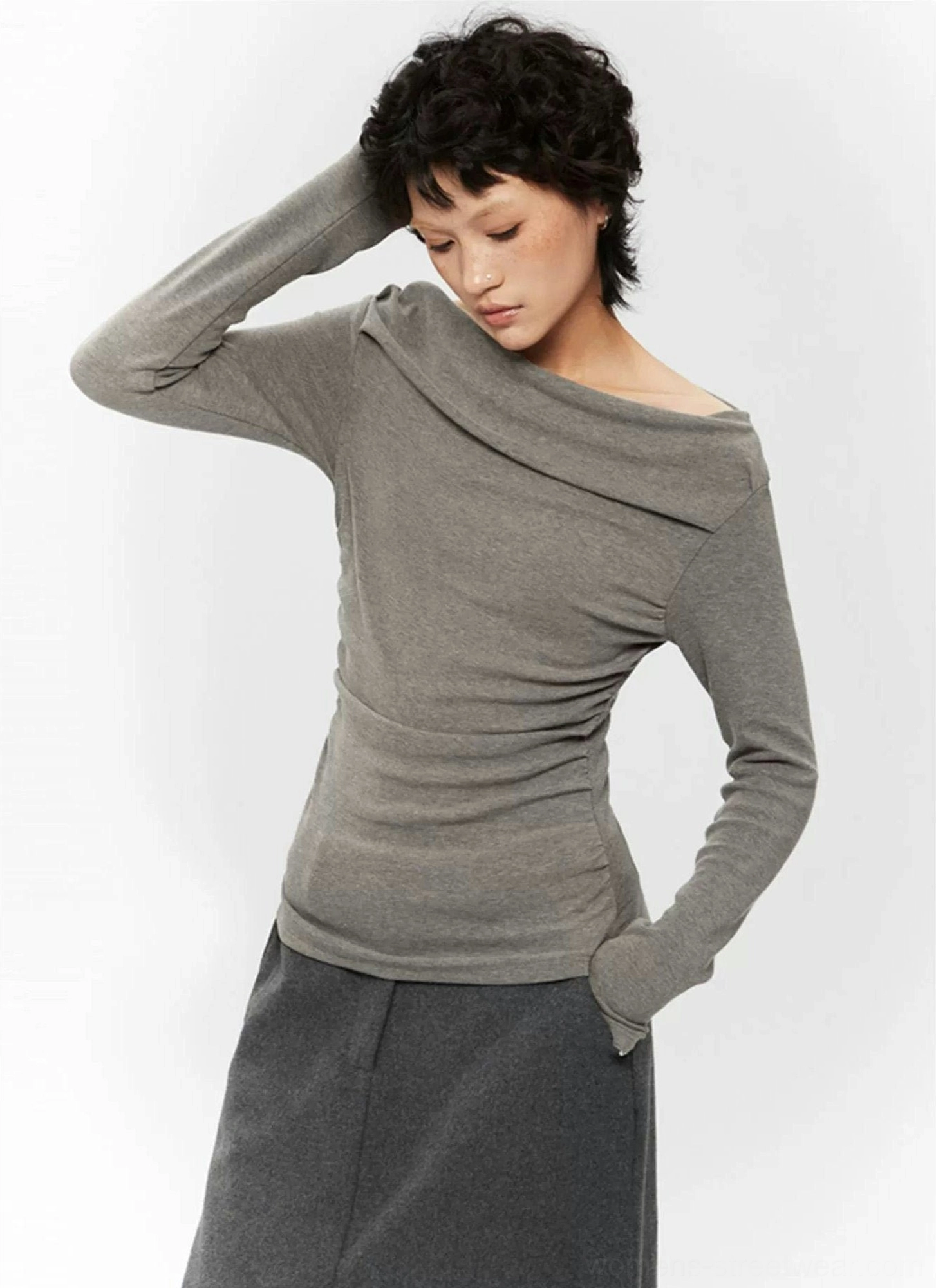 Y2K-inspired off-shoulder ruched top with sculpted fit, long sleeves, and feminine Seoul fashion styling