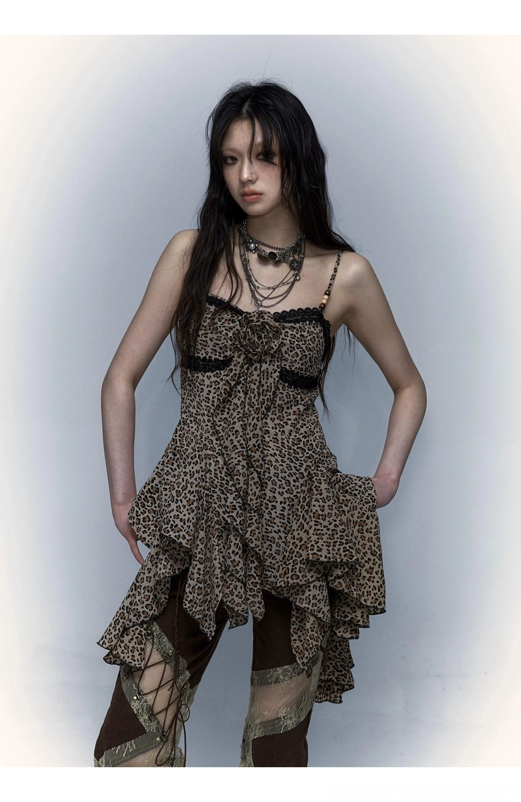 Leopard print sheer handkerchief-hem camisole layered with necklaces and patchwork cargo pants