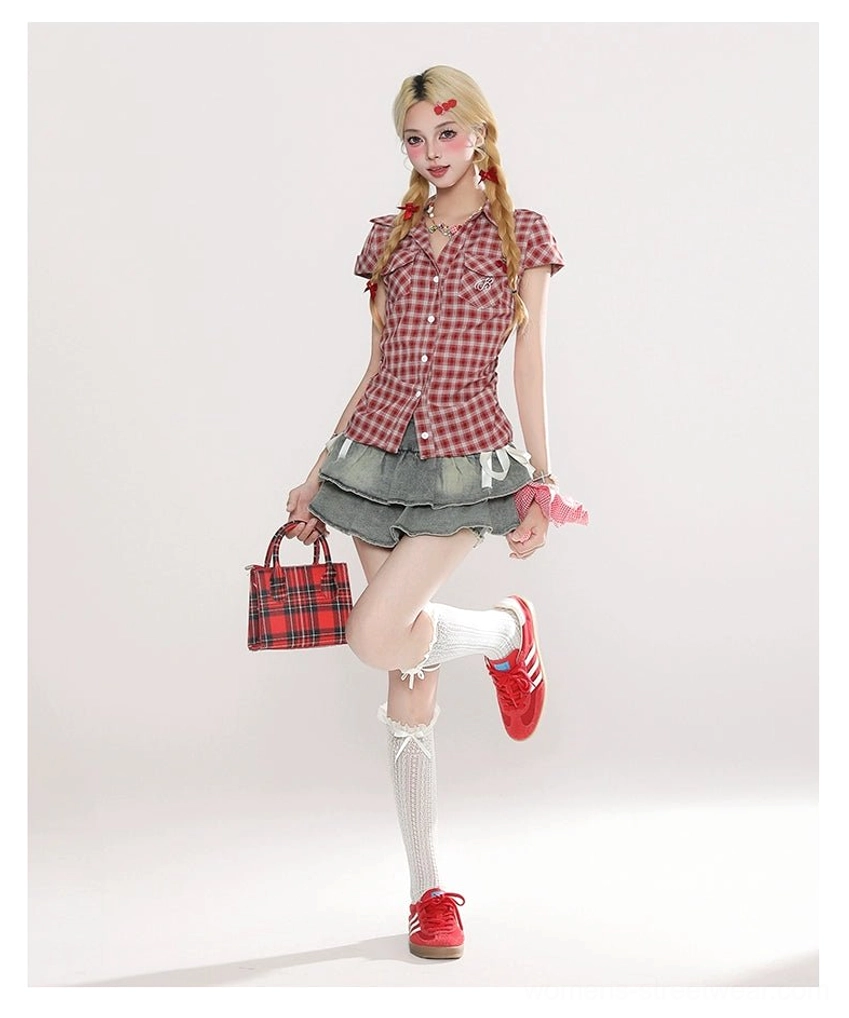 Full Y2K outfit featuring a layered light blue ruffle mini skirt, red plaid shirt, white knee-high socks, red sneakers, plaid handbag, and pink hair scrunchies
