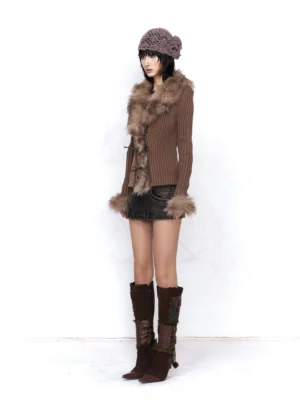 Asian female model wearing a fitted mocha brown faux fur trimmed ribbed knit cardigan with a deep V neckline, cropped silhouette, leather mini skirt, crocheted beret, and knee high boots in a Korean Y2K streetwear outfit