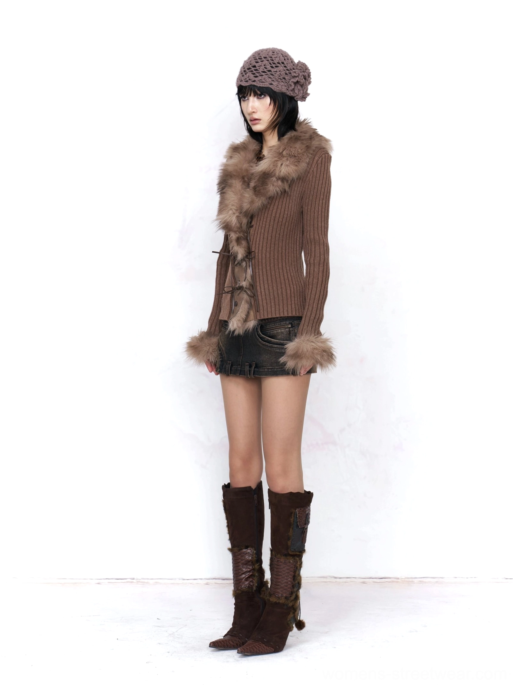 Asian female model wearing a fitted mocha brown faux fur trimmed ribbed knit cardigan with a deep V neckline, cropped silhouette, leather mini skirt, crocheted beret, and knee high boots in a Korean Y2K streetwear outfit