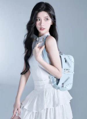 Baby blue Y2K baguette shoulder bag with curved underarm silhouette, silver hardware, and chain strap front view