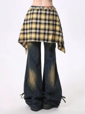 Front close-up of vintage washed wide leg denim jeans with yellow black plaid overlay waist wrap and adjustable drawstring hems