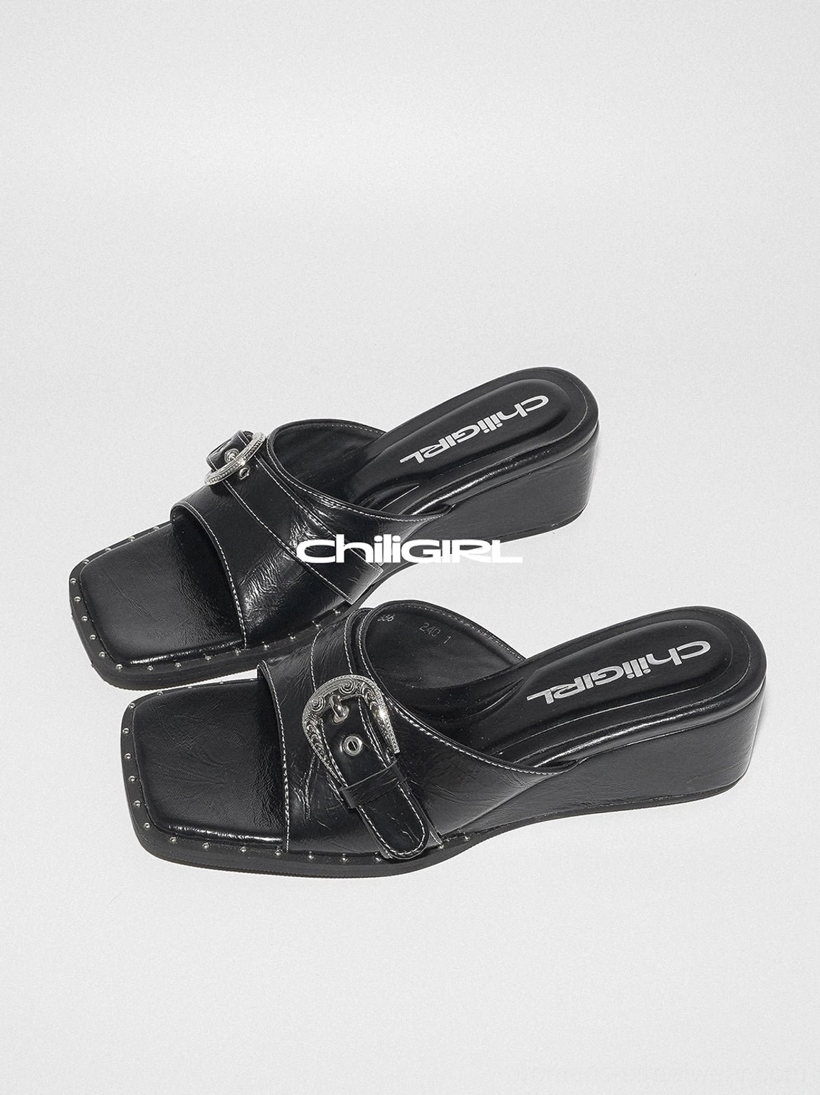 Contemporary Y2K square-toe buckle slide sandals with glossy finish and easy slip-on silhouette