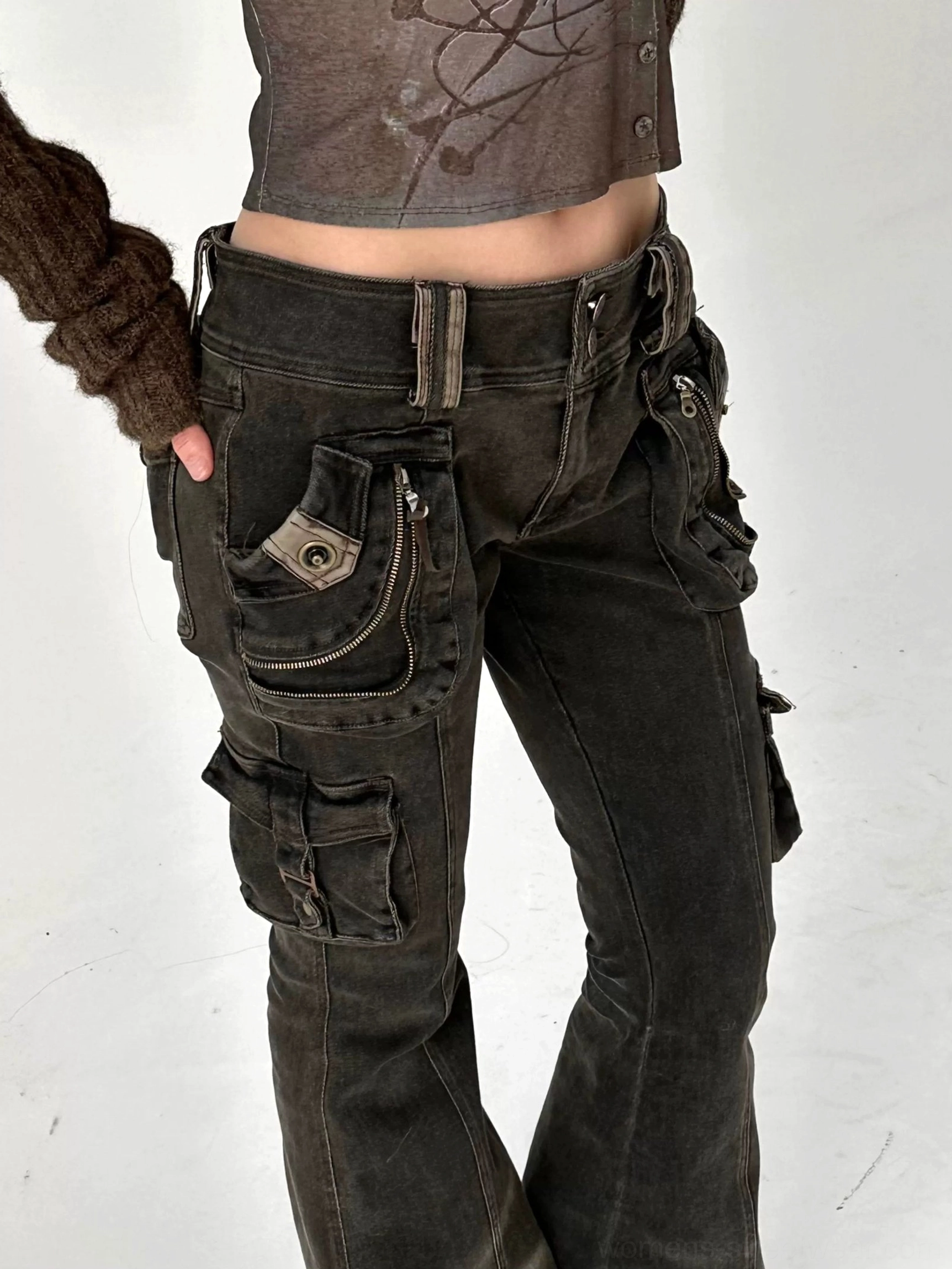 Y2K streetwear inspired washed black cargo flare jeans with low-rise fit, utility pockets, structured denim, and wide flared legs