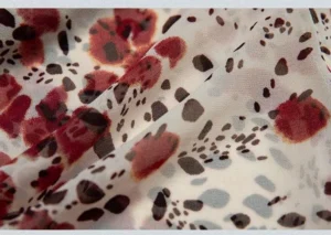 Close-up of vintage floral print semi-sheer chiffon fabric for Y2K handkerchief-hem camisole