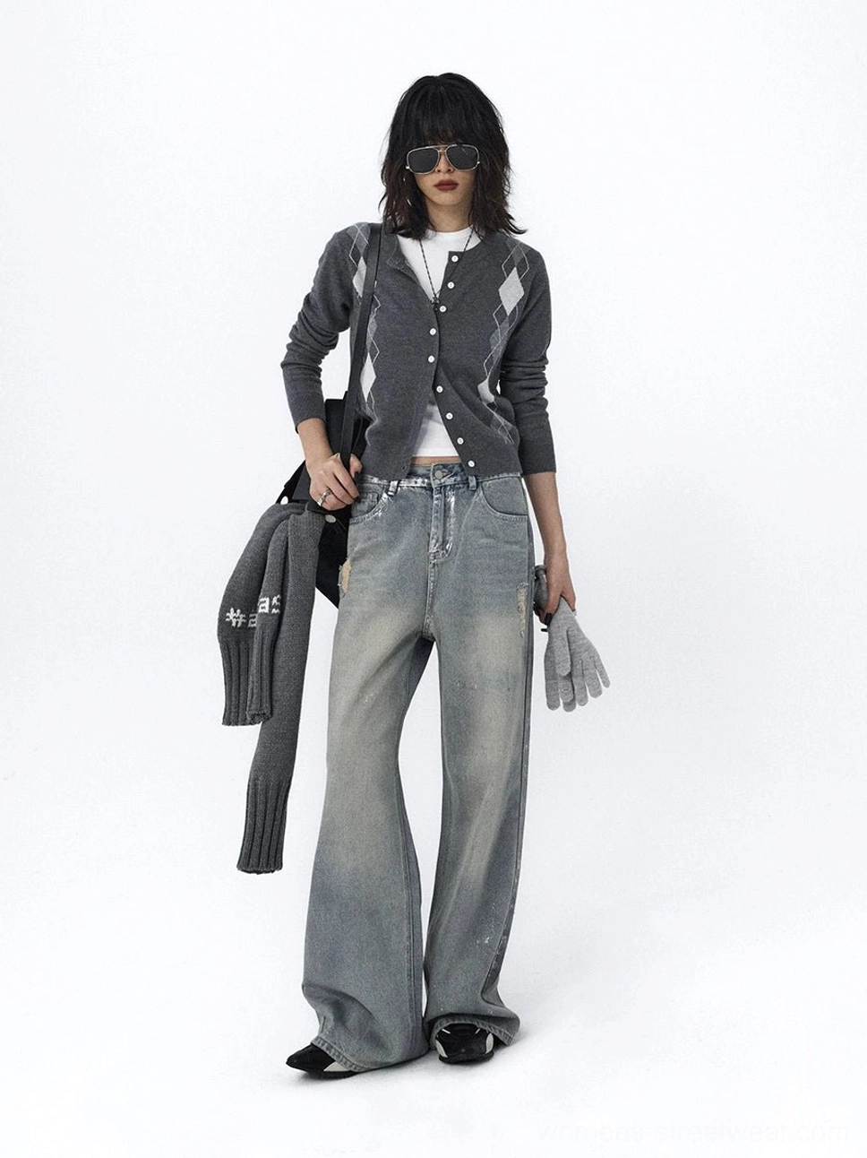 Y2K streetwear outfit with distressed wide-leg jeans, grey argyle cardigan, white crop top, loafers, and sunglasses