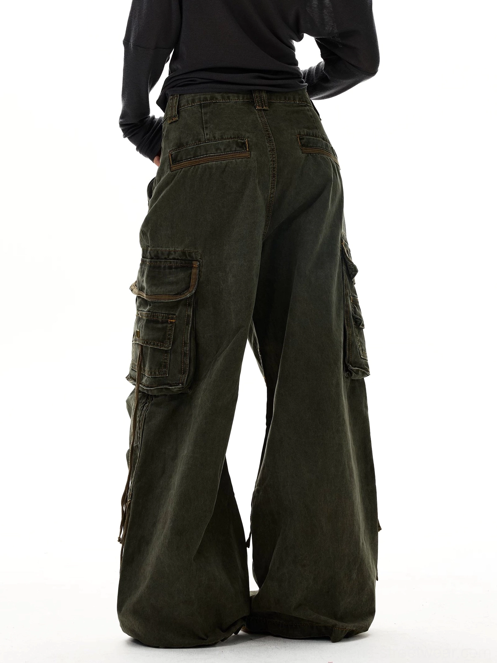 Olive green wide leg strap cargo jeans rear view featuring flap back pockets baggy legs and washed denim texture