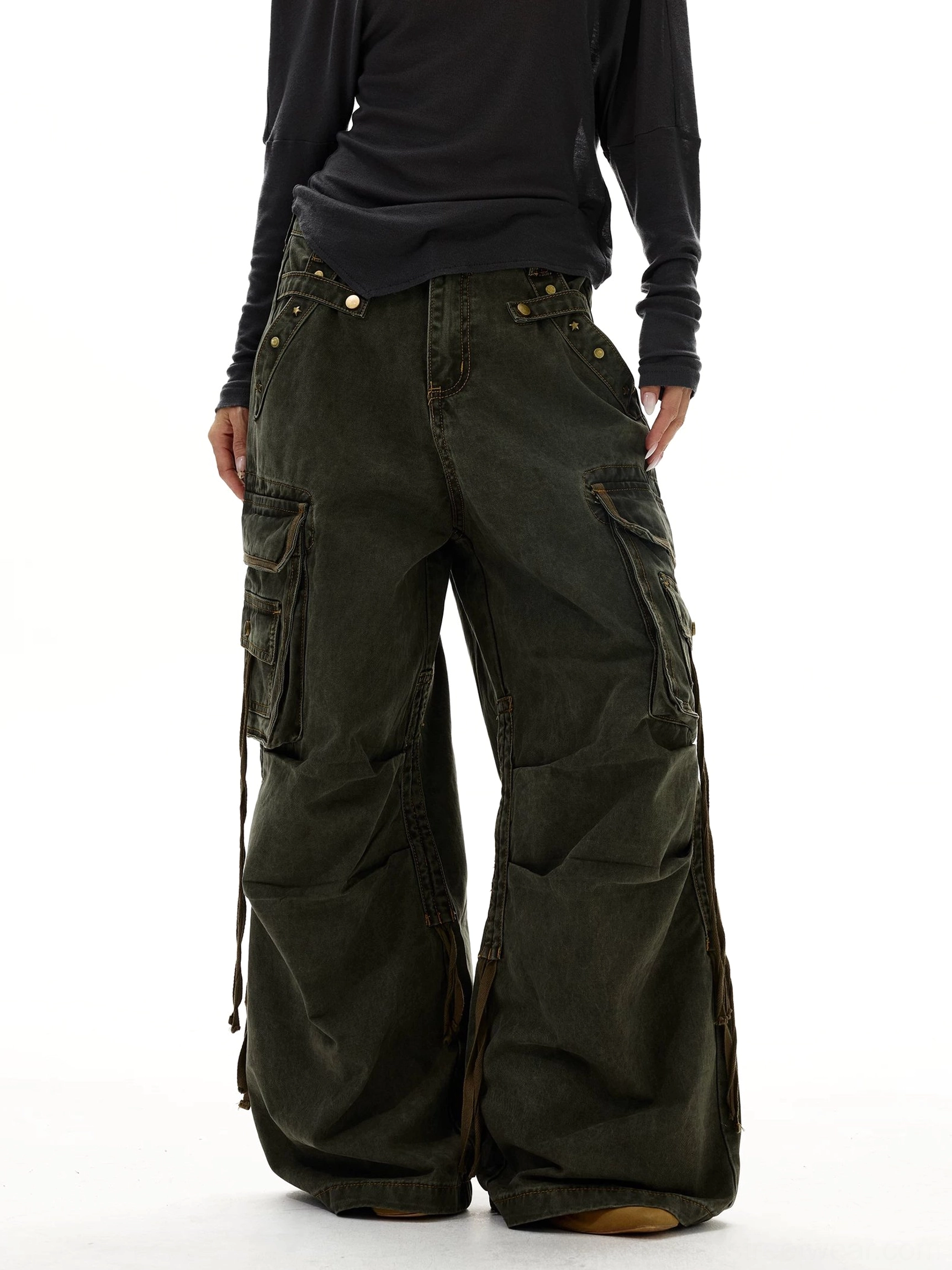 Olive green Y2K wide leg strap cargo jeans side front view with oversized cargo pockets and washed denim finish
