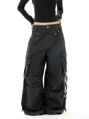 Washed gray Y2K wide leg strap cargo jeans front lower body view with oversized utility pockets and baggy denim legs