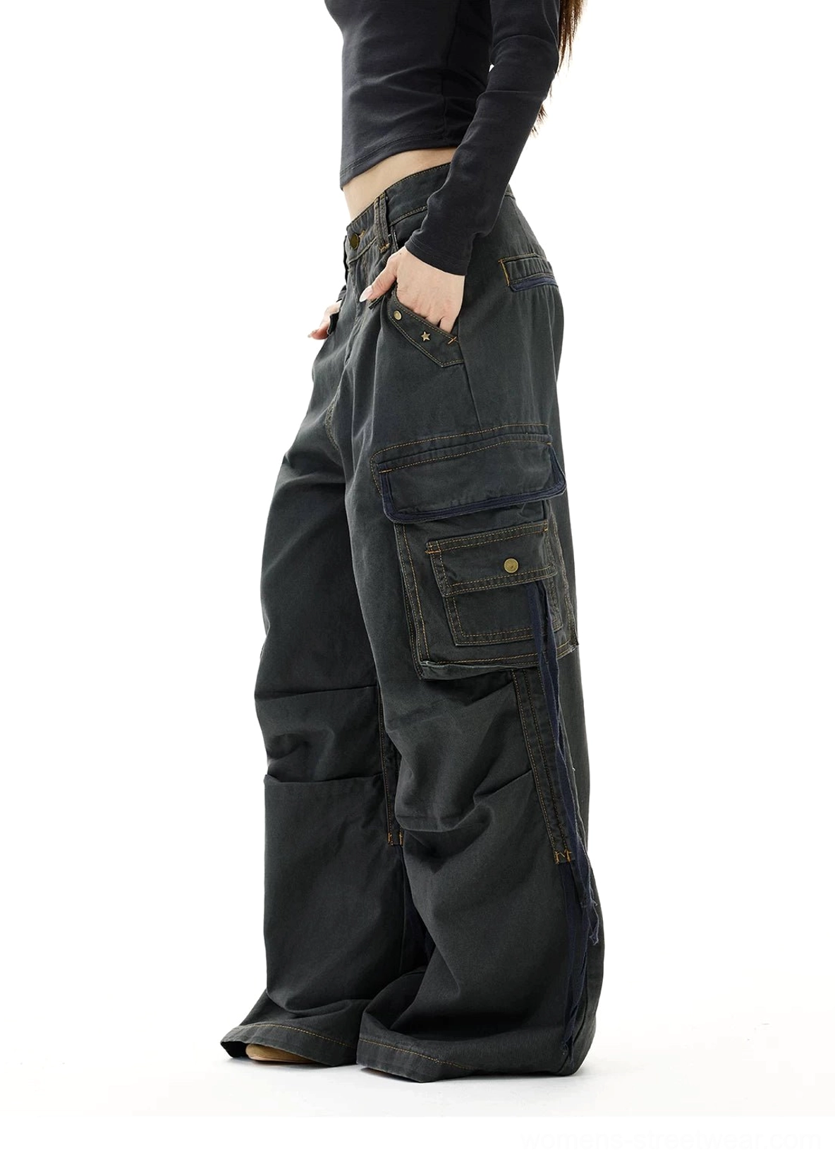 Washed gray wide leg strap cargo jeans side view highlighting oversized side pockets decorative straps and baggy fit