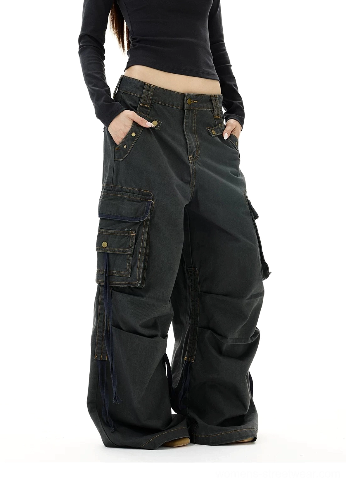 Washed gray Y2K cargo jeans three quarter front view with button fly flap pockets and riveted strap accents