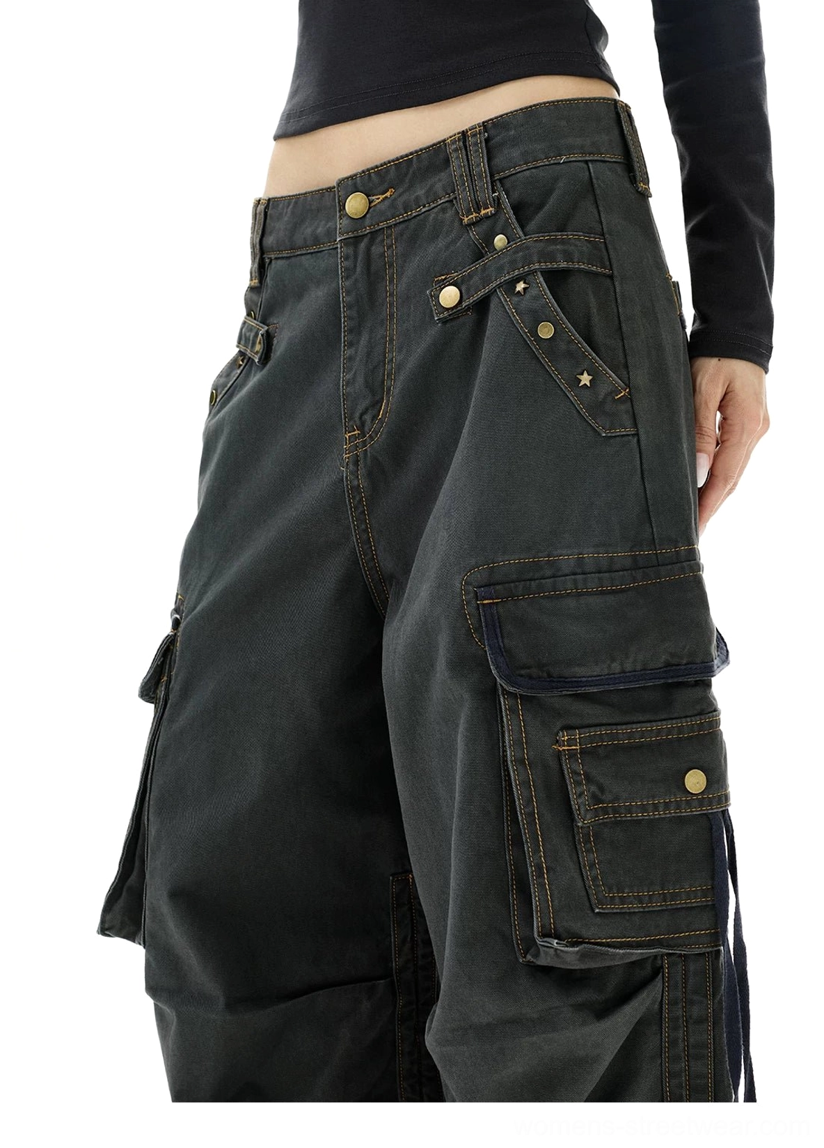 Close-up of washed gray Y2K strap cargo jeans waistband brass hardware flap pockets and contrast stitching