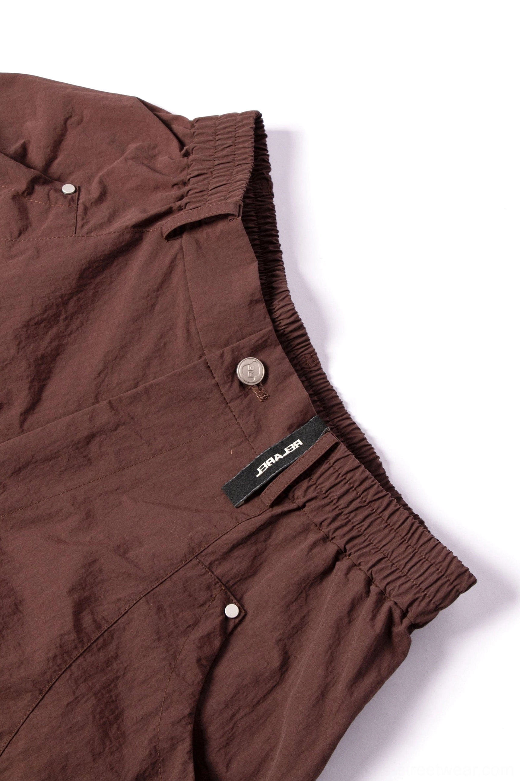 Wide leg technical cargo pants suitable for Y2K streetwear outfits with drawstring waist and loose utility silhouette