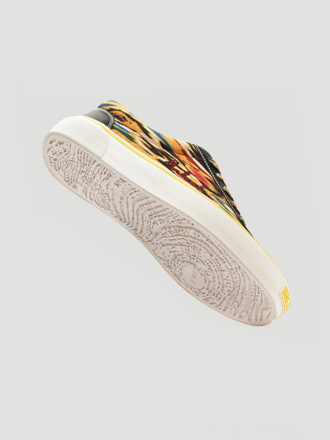 Art-inspired yellow canvas skate sneakers with multicolor abstract pattern and clean white outsole