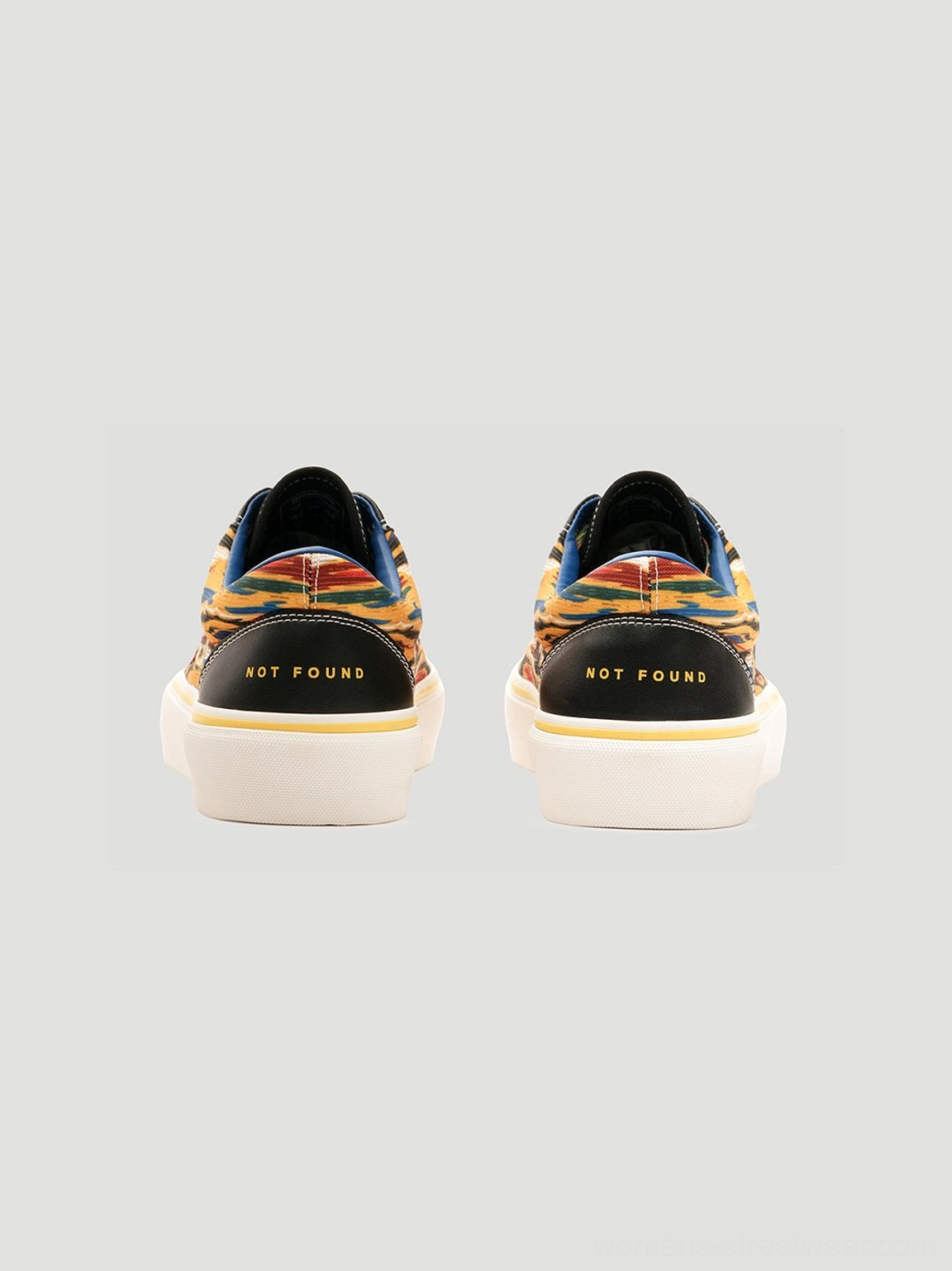 Yellow abstract graphic canvas sneakers with white rubber sole and colorful Seoul-inspired fashion aesthetic