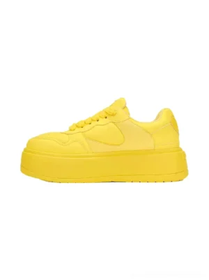 Yellow Cupid heart platform sneakers in left side profile showing bright yellow PU leather upper and chunky foam rubber sole