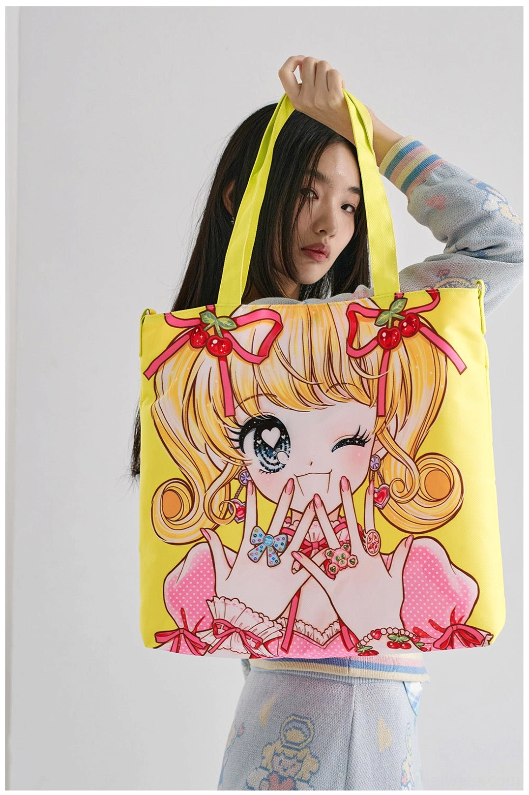 Yellow kawaii anime girl printed tote bag with neon yellow adjustable crossbody strap styled with Y2K fashion