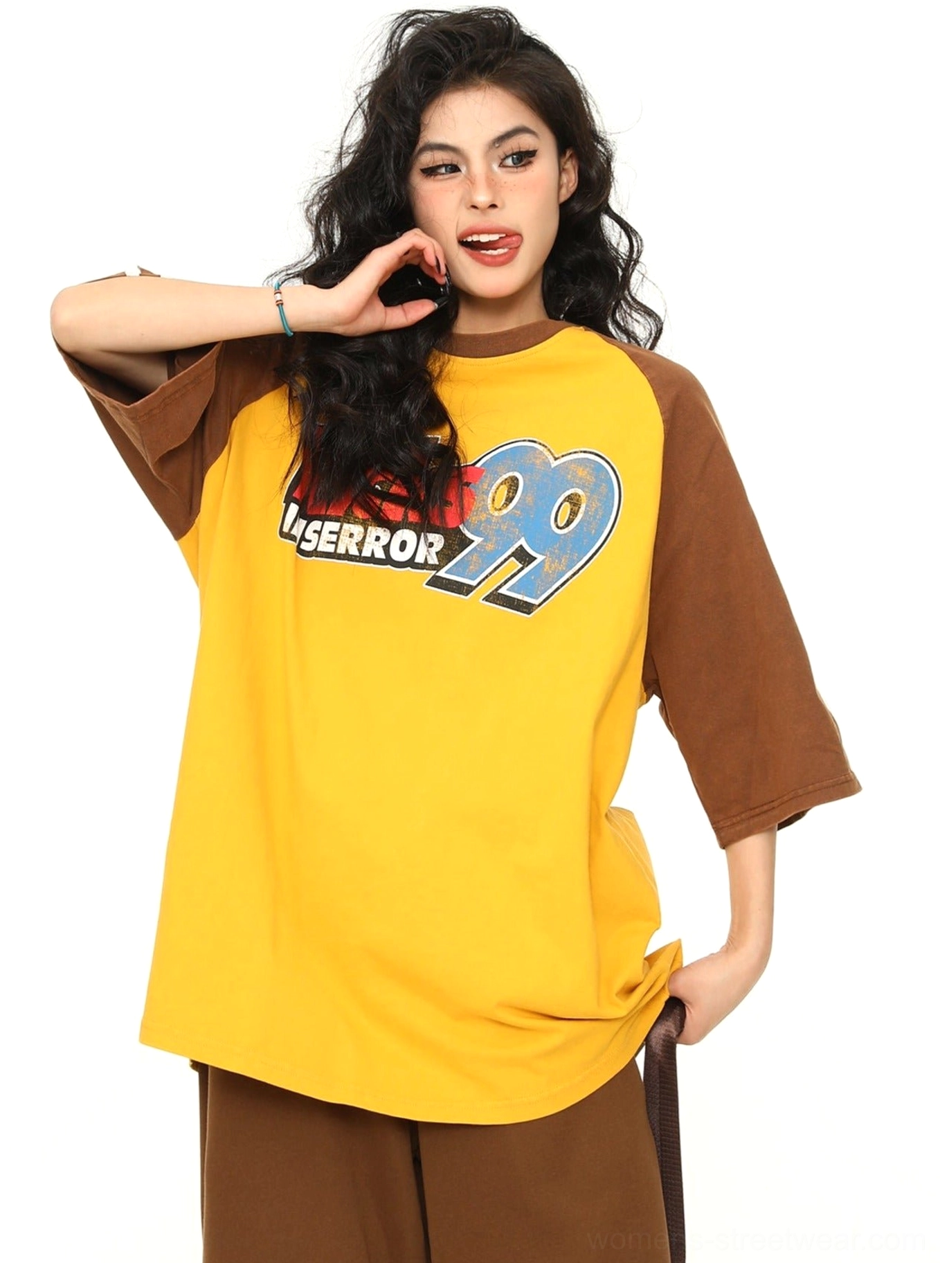 Yellow oversized varsity baseball raglan graphic T-shirt with a relaxed streetwear fit and retro athletic design