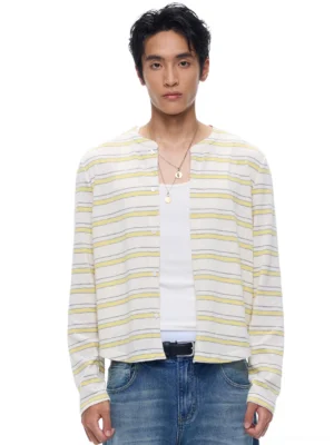 Yellow pastel stripe cropped cardigan with button front and crew neckline layered over a white tank top