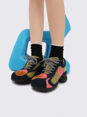 Yellow patchwork bear platform sneakers with sculpted rubber foam soles, gingham panels, striped rope laces, and cute character toe appliques