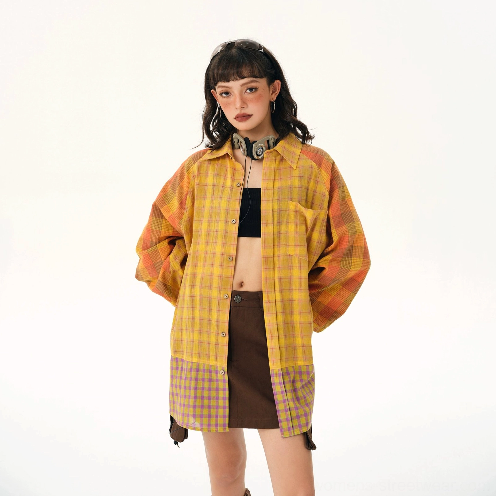 Yellow plaid patchwork oversized shirt front view showing button closure chest pocket and contrast plaid hem panels