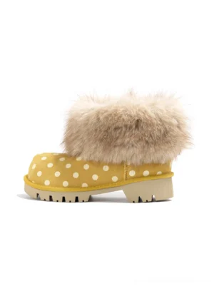 Yellow polka dot faux fur cuff chunky platform snow boot left side profile on white background