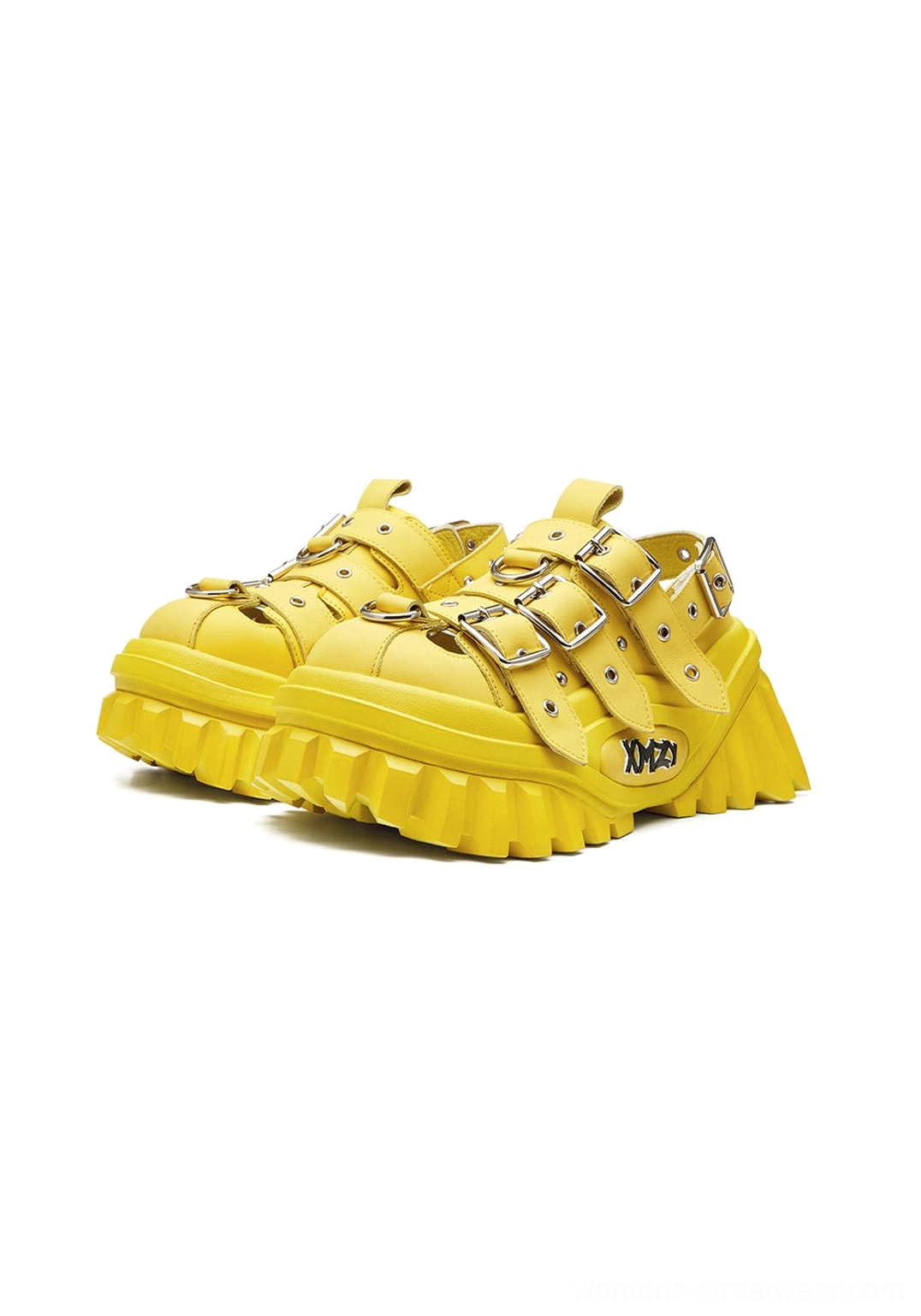 Front view of yellow punk triple-buckle platform sandals with smooth leather-look upper and chunky serrated lug sole