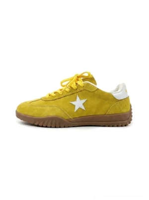 Front view of bright yellow suede star trainers with white side emblem, white heel tab, lace-up front, and gum rubber outsole