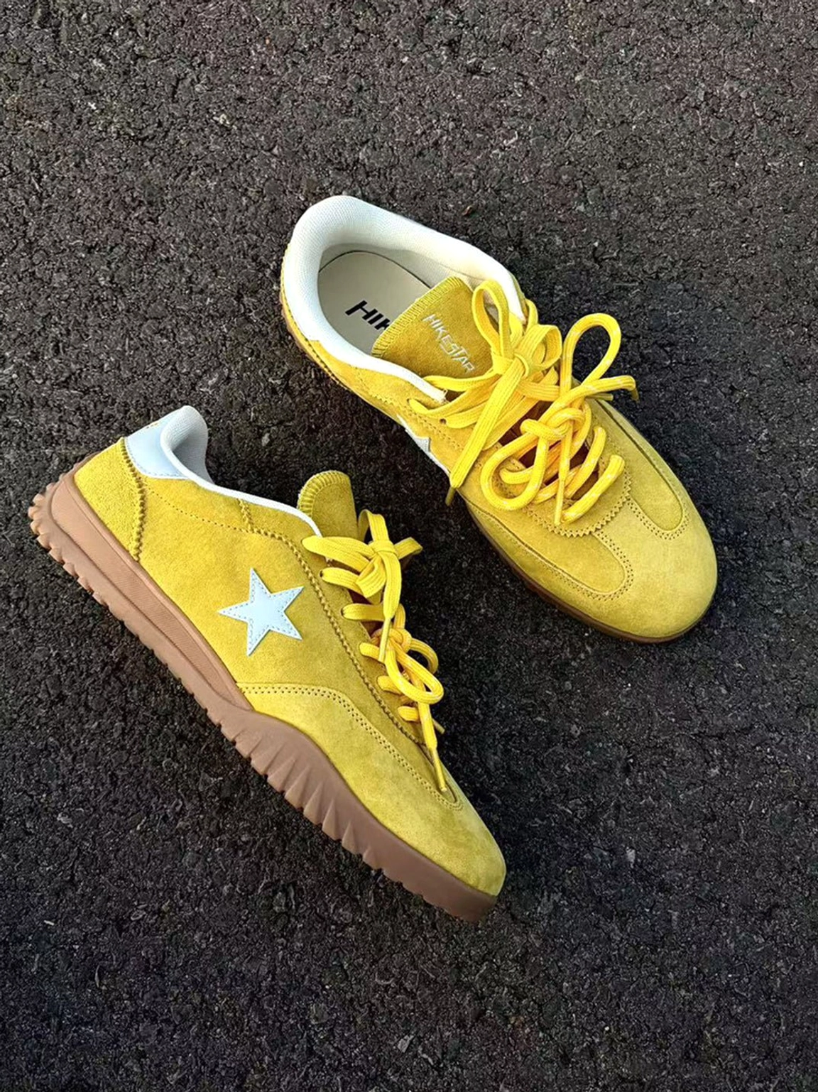 Yellow suede streetwear trainers with contrast star detail and gum-tone rubber outsole for vintage urban outfits