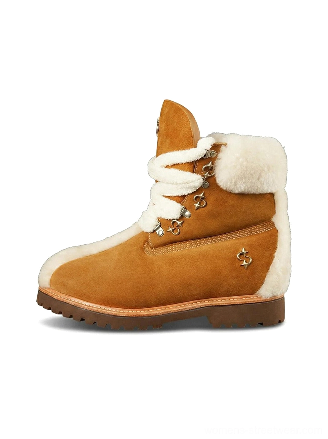 Warm yellow tan suede shearling-lined work boots with oversized white laces, plush collar, rounded toe, metal eyelets, and thick lugged rubber outsole shown from the left side