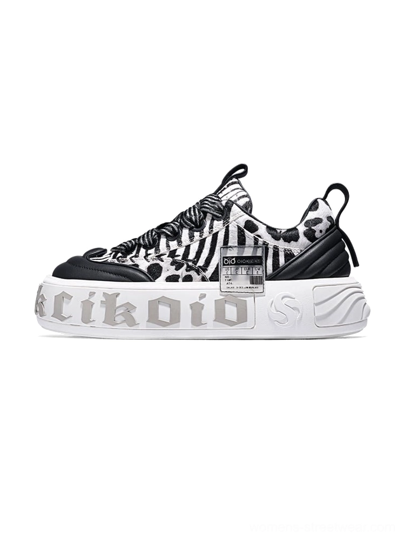 Zebra print chunky skate sneaker in black and white with black toe cap, textured upper, and thick white platform outsole
