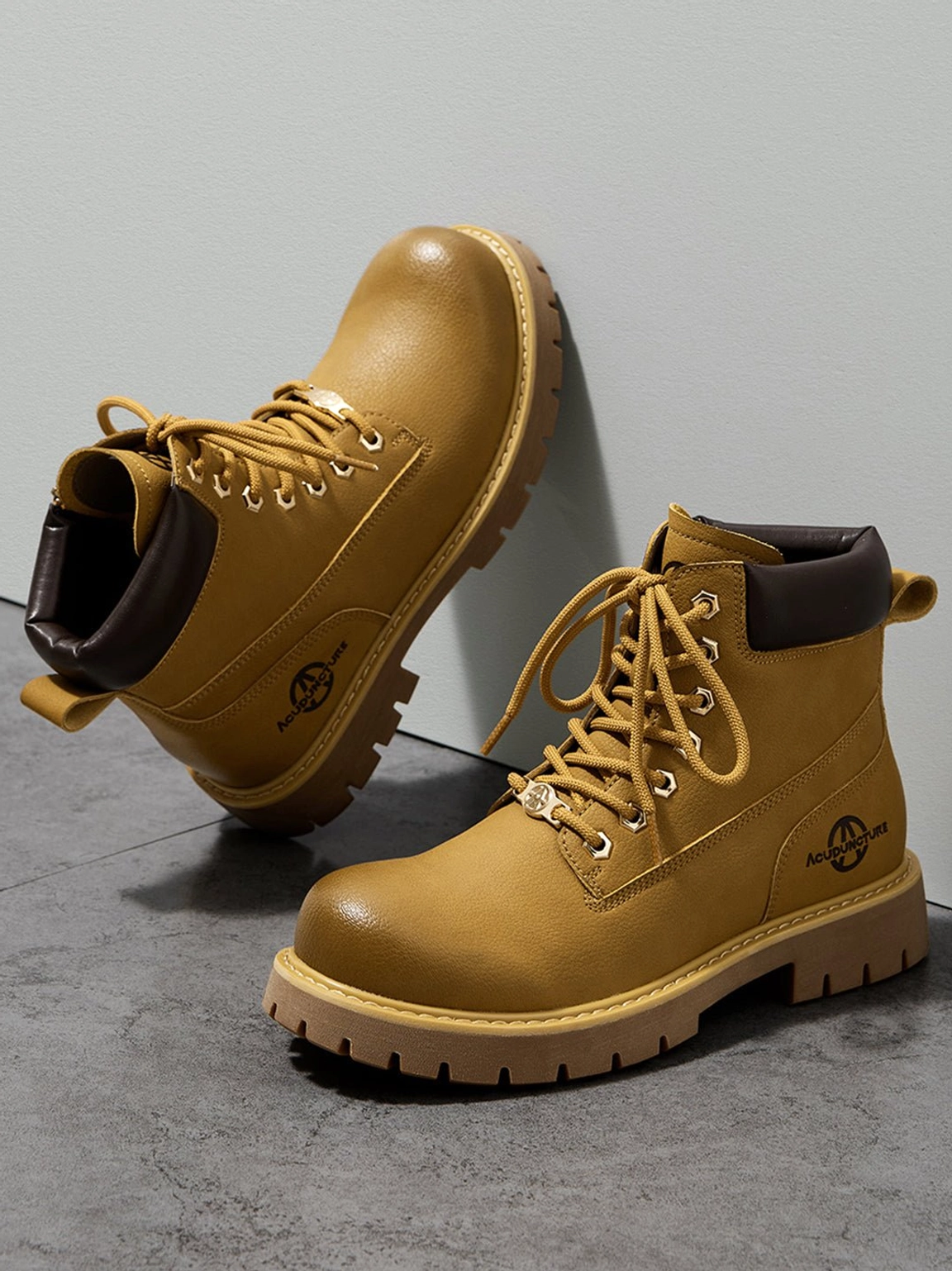 Tactical zip-front lug-sole ankle boots close-up padded collar construction detail synthetic upper material